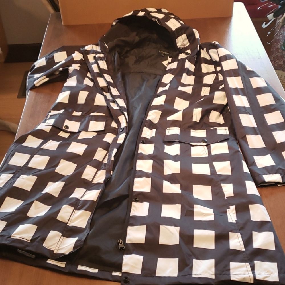 Black and white checked rain coat with hood